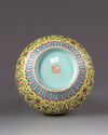 A Chinese yellow-ground famille rose bottle vase