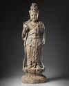 A LARGE CHINESE POLYCHROME-DECORATED WOOD CARVING OF GUANYIN, POSSIBLY SONG-YUAN DYNASTY