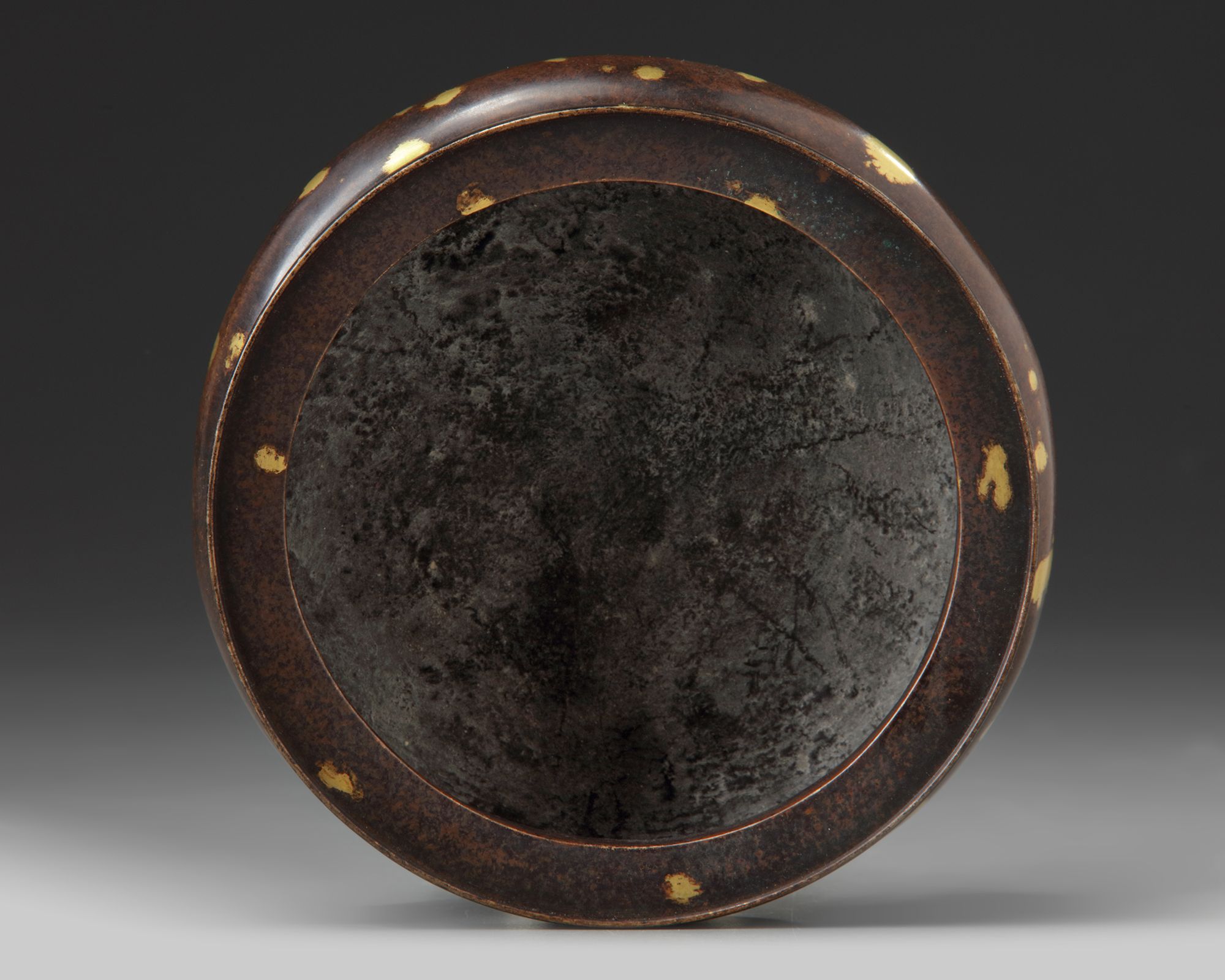 A Chinese gilt splashed bronze tripod censer