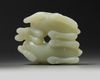 A Chinese pale celadon ‘twin ram’ carving