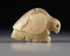 A WESTERN ASIATIC MARBLE SEAL AMULET IN THE FORM OF A BIRD OF PREY, LATE URUK PERIOD, CIRCA 3300-2900 B.C.