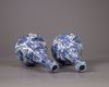 A pair of Chinese moulded blue and white 'Kraak' garlic neck vases