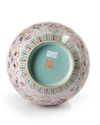 A CHINESE PINK-GROUND FAMILLE ROSE VASE