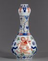 A Chinese wucai glazed 'dragons' garlic-head vase