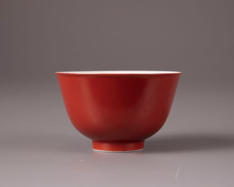 A coral-red glazed bowl