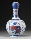 A Chinese copper-red-decorated blue and white garlic-head vase