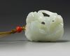 A Chinese white jade 'Buddhist lion and cubs' carving