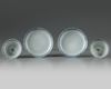 A pair of Chinese bianco sopra bianco-decorated cups and saucers