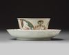 A Chinese famille rose ‘figural’ cup and saucer