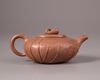 A Chinese yixing 'lotus-leaf' teapot and cover