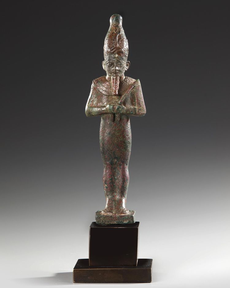 AN EGYPTIAN BRONZE OSIRIS STATUE, 26TH DYNASTY, CIRCA 664–525 B.C.