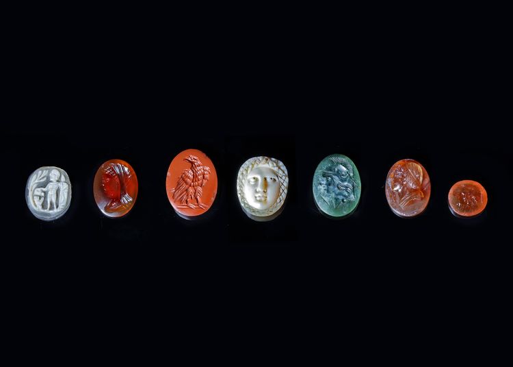 FOUR INTAGLIOS AND THREE CAMEOS IN VARIOUS MATERIALS, ANCIENT AND MODERN