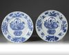A pair of Chinese blue and white 'flower basket' dishes