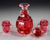 A BOHEMIAN RUBY CUT GLASS 'DRINKING SET' FOR THE ISLAMIC MARKET, CIRCA 1860
