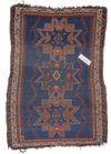 AN ANTIQUE CAUCASIAN SHIRVAN RUG WITH THREE STAR MEDALLIONS
