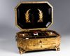 A Chinese gilt and black lacquered box and cover