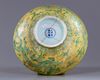 A large Chinese yellow-ground green decorated 'dragon' bowl