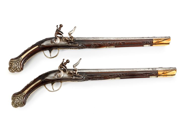 A PAIR OF OTTOMAN SILVER-MOUNTED ORIENTAL FLINTLOCK PISTOLS, CIRCA 1820 - 1830