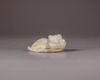 A Chinese pale celadon jade 'cat and dragonfly' carving