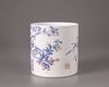 A Chinese blue and white and underglaze red brush pot, bitong