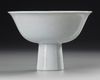 A CHINESE WHITE-GLAZED ANHUA DRAGON STEM CUP, EARLY 18TH CENTURY