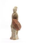A Chinese painted pottery model of a standing warrior