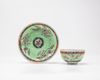 A famille verte cup and saucer