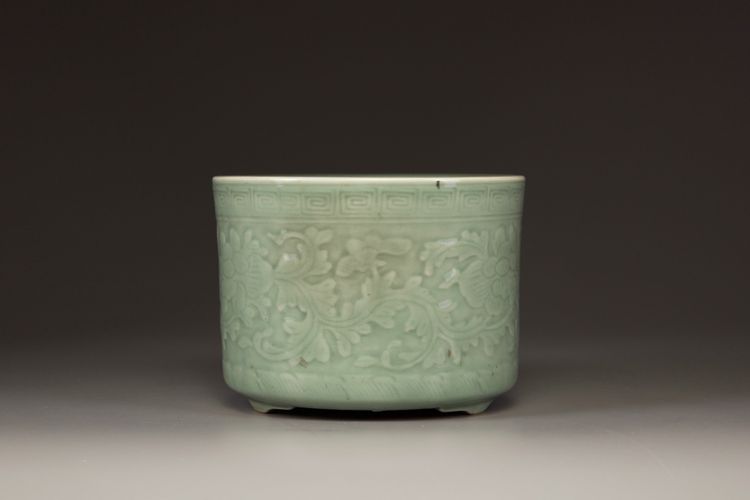 A Chinese celadon glazed tripod censer