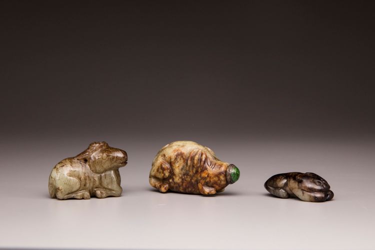 Two jade animal carvings and a jade snuff bottle