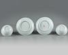 A pair of Chinese bianco sopra bianco-decorated cups and saucers