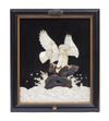 An exceptional framed relief of an eagle perched on a rock