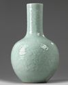 A CHINESE CARVED AND MOULDED CELADON-GLAZED BOTTLE VASE