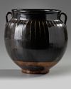 A Chinese brown-glazed ribbed jar