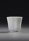 A CHINESE LOTUS SHAPED BLANC DE CHINE CUP, 18TH CENTURY
