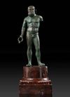 A GRECO ROMAN BRONZE STATUETTE OF HERAKLES, CIRCA 1ST CENTURY B.C. / A.D.