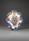 A PAIR OF MIXED TECHNIQUE POLYCHROME DELFT PLAQUES, MID 18TH CENTURY