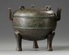 A Chinese bronze tripod ding and cover