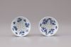 A pair of blue and white porcelain pounces