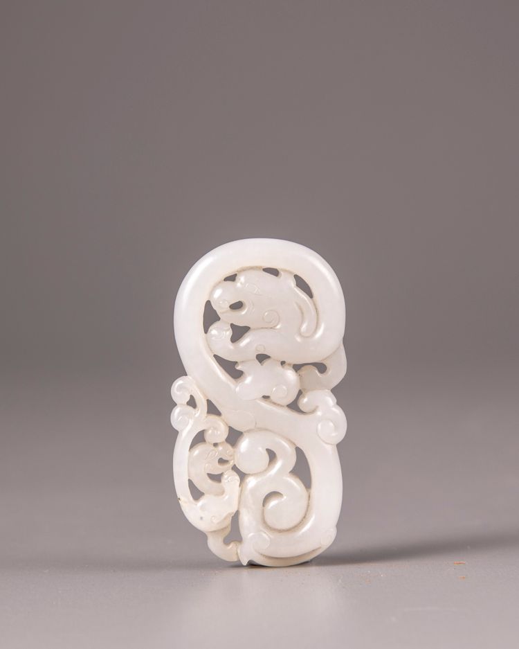 A Chinese white jade 'twin dragon' plaque