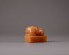 A Chinese yellow soapstone 'tiger' seal