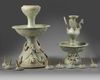 A CHINESE GREEN-GLAZED POTTERY TWO-TIERED OIL LAMP