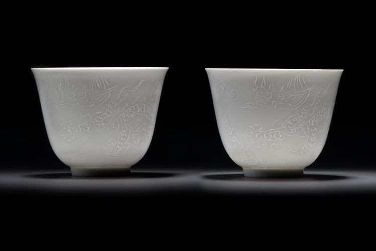 A  PAIR OF SMALL CHINESE WHITE-GLAZED DRAGONS CUPS, 20TH CENTURY
